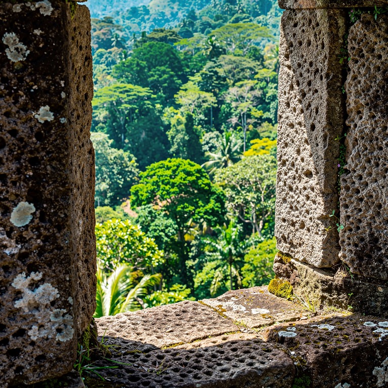 Stone monastery window looking out onto a green forested val... | ShopAyahuascaRetreats